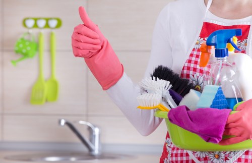 Staff member using protective measures during carpet cleaning