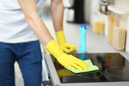 Carpet cleaning technician using PPE during a cleaning job